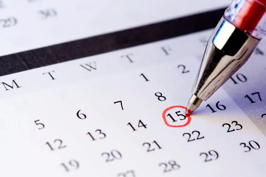 Close-up of a calendar with a marked date representing a scheduled cockroach inspection appointment.
